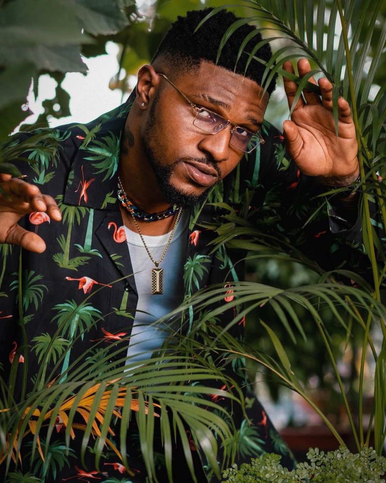 Close Brook-Lyfe artist portrait among tropical plants