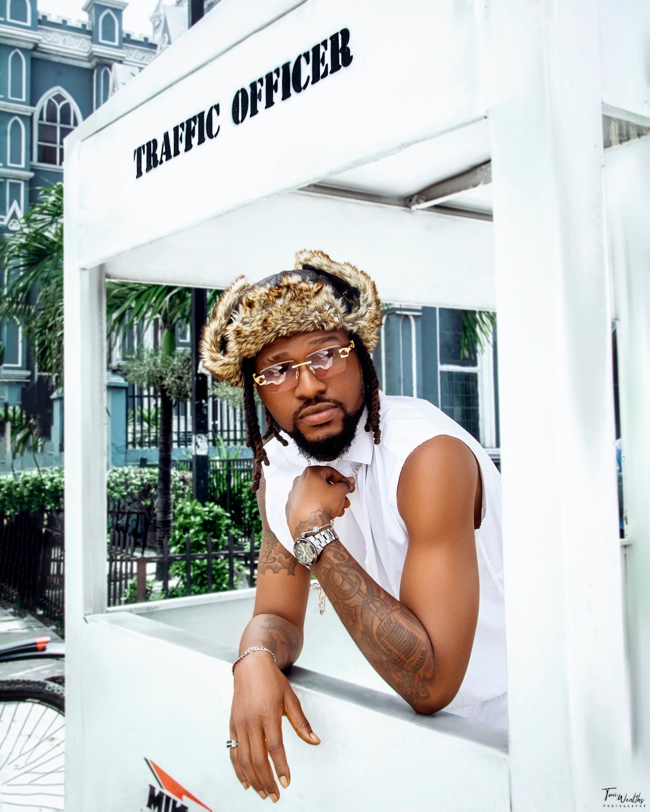 Brook-Lyfe artist wearing a fur hat and glasses