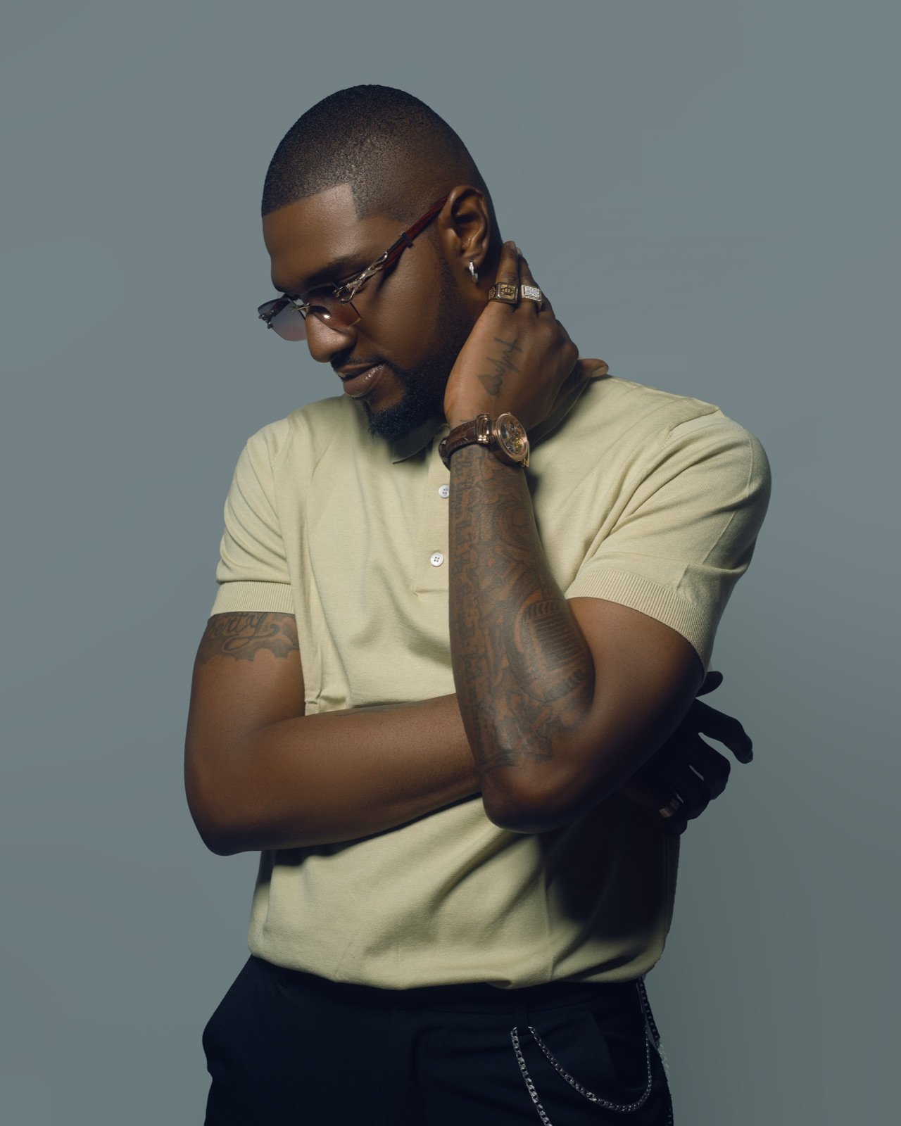Brook-Lyfe artist in a sage polo and glasses