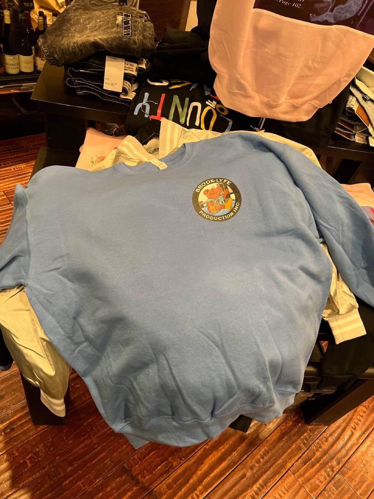 Light blue Brook-Lyfe crewneck with embroidered chest logo