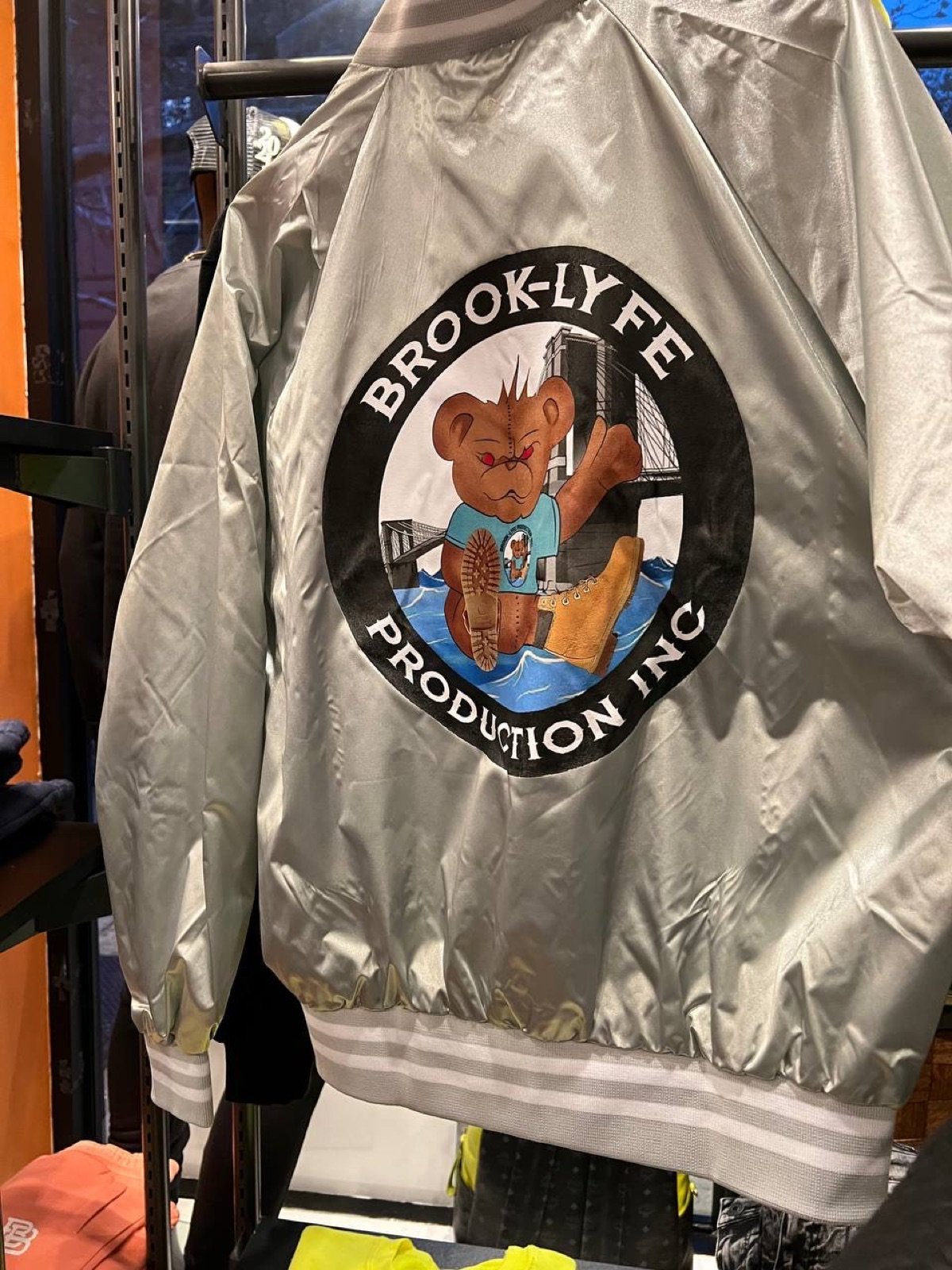 Large Brook-Lyfe logo on silver satin jacket