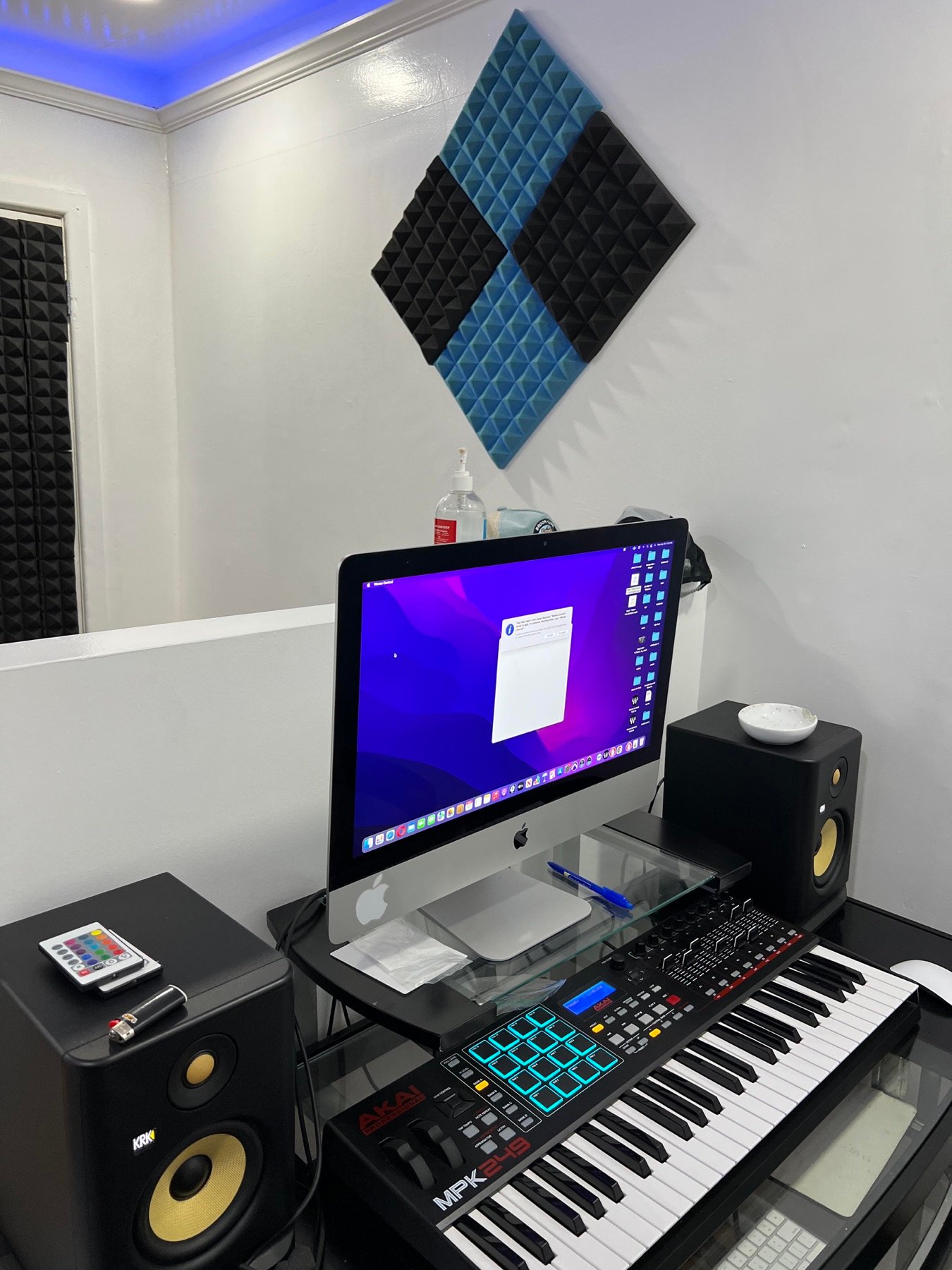 Brook-Lyfe production desk with iMac, studio monitors, MIDI keyboard, and drum pads