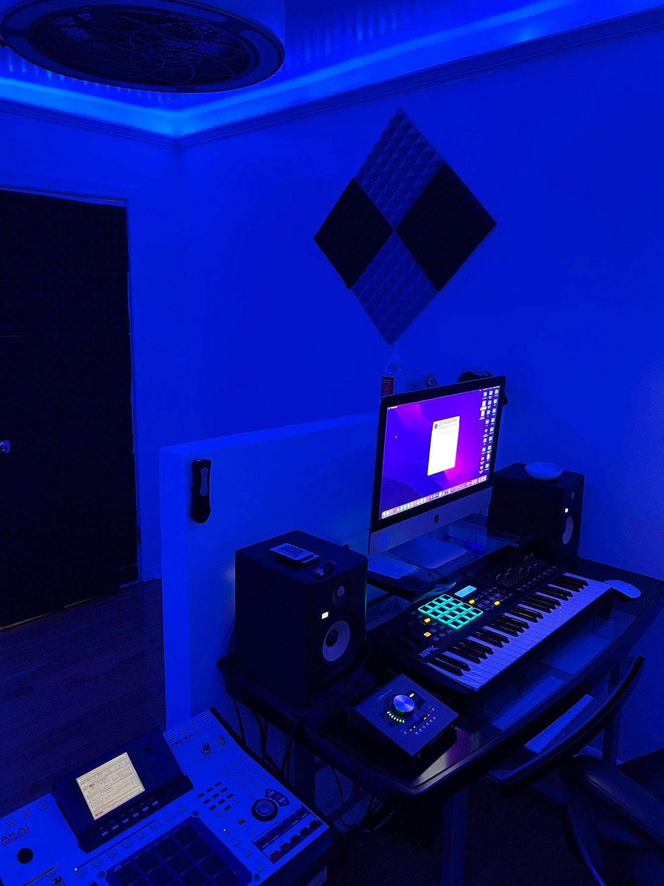 Wide view of the Brook-Lyfe studio room under blue lighting